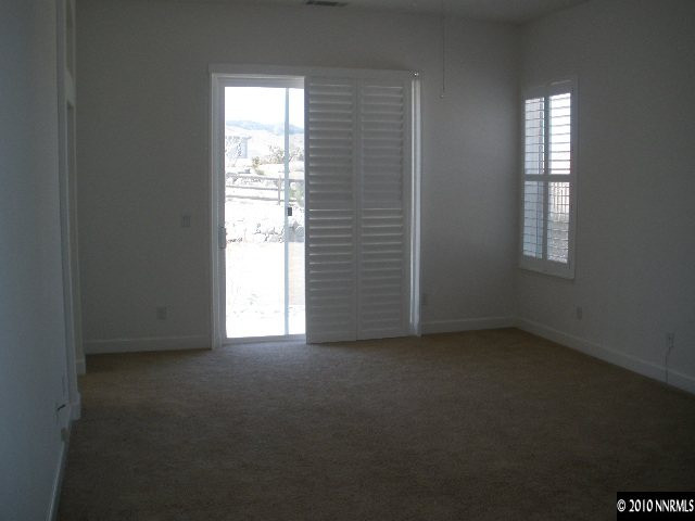 5802 North White Sands Road Reno, NV 89511 - Photo 5 of 9 an empty room with windows
