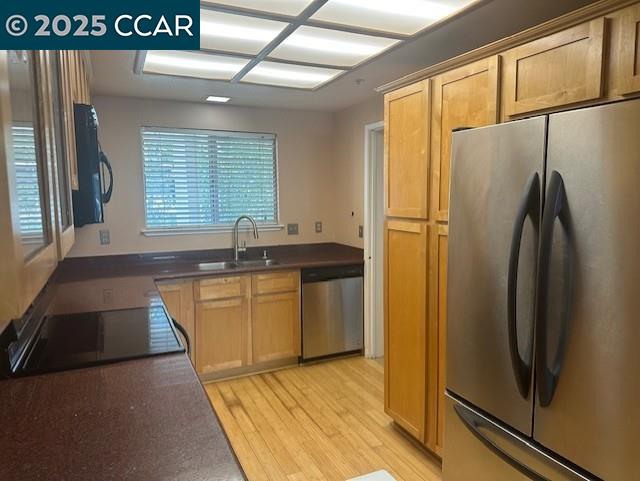 2723 Oak Road, Unit K Walnut Creek, CA 94597 - Photo 5 of 15 a kitchen with stainless steel appliances granite countertop a refrigerator and a sink