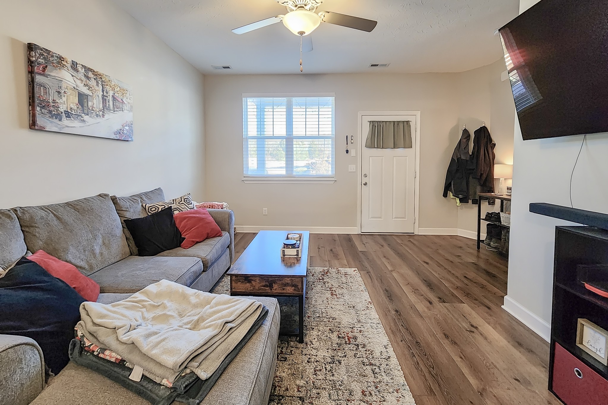 1382 Rural Hill Road, Unit 304 Antioch, TN 37013 - Photo 11 of 21 a living room with furniture and a flat screen tv