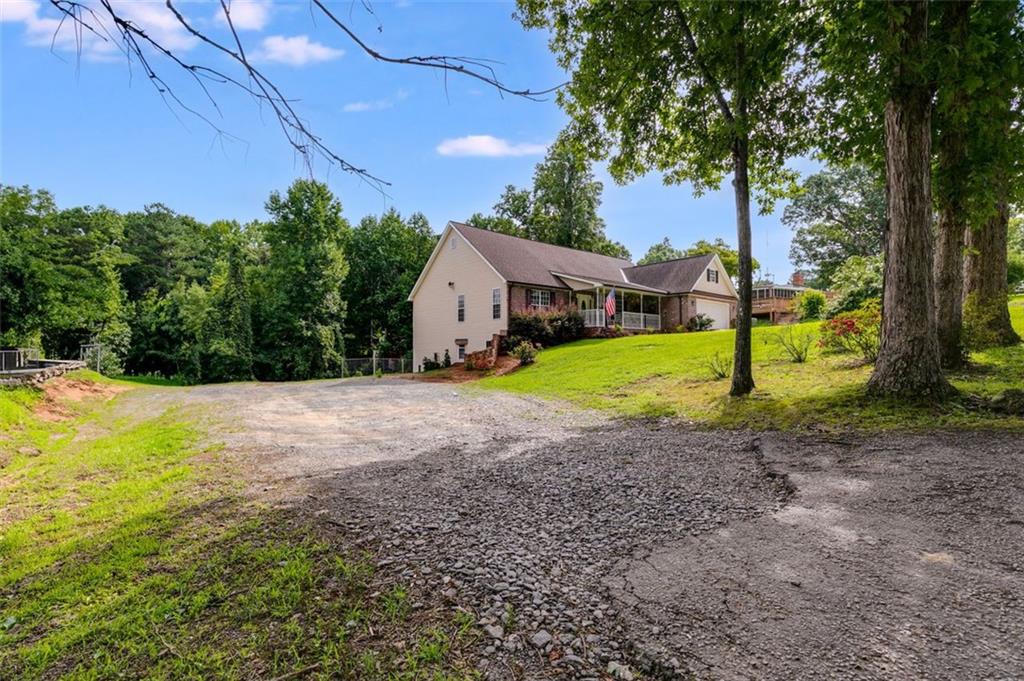 144 Bobs Drive Mableton, GA 30126 - Photo 27 of 33 a view of outdoor space with garden and trees
