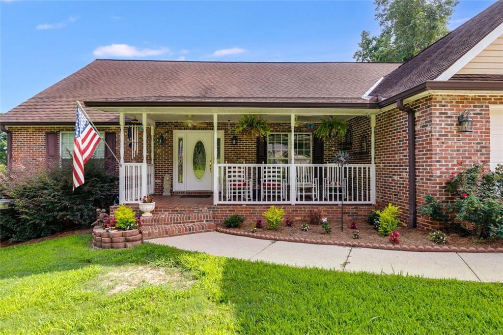 144 Bobs Drive Mableton, GA 30126 - Photo 3 of 33 a view of a house with potted plants and a yard