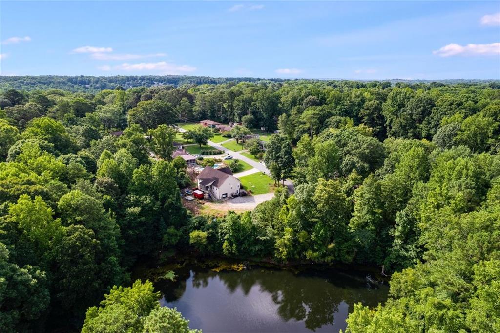 144 Bobs Drive Mableton, GA 30126 - Photo 33 of 33 a view of a lake with a house in the background