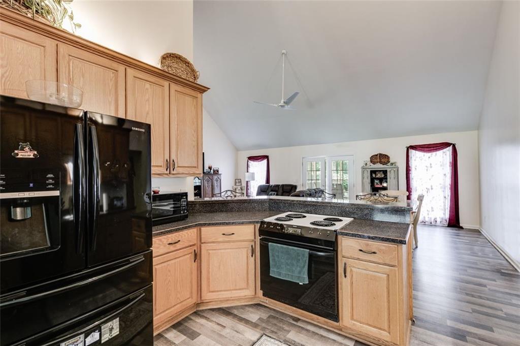 144 Bobs Drive Mableton, GA 30126 - Photo 8 of 33 a kitchen with granite countertop stainless steel appliances and wooden cabinets
