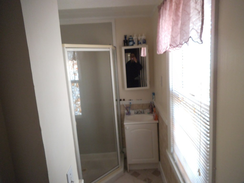 149 Franklin Street Fall River, MA 02720 - Photo 14 of 14 a bathroom with a sink and a mirror