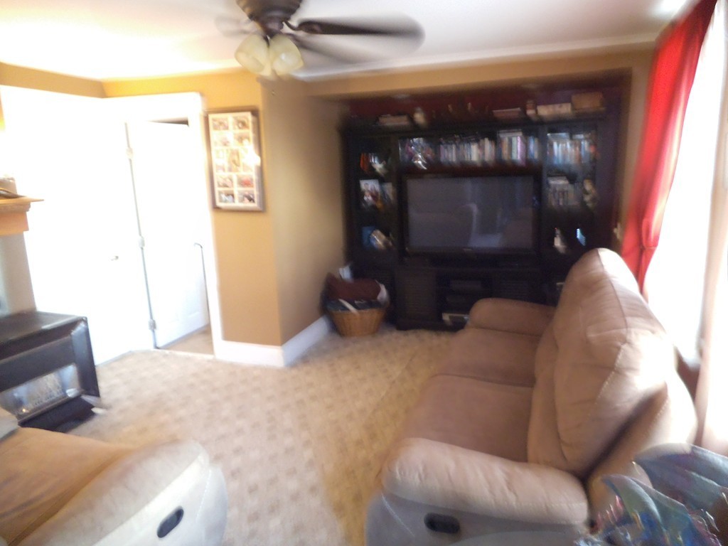 149 Franklin Street Fall River, MA 02720 - Photo 5 of 14 a living room with furniture and a fireplace