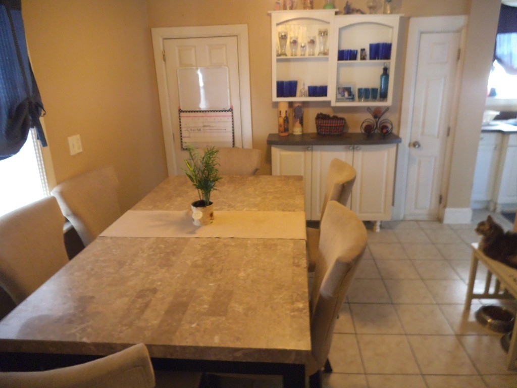 149 Franklin Street Fall River, MA 02720 - Photo 6 of 14 a workspace with stainless steel appliances kitchen island granite countertop a sink and cabinets
