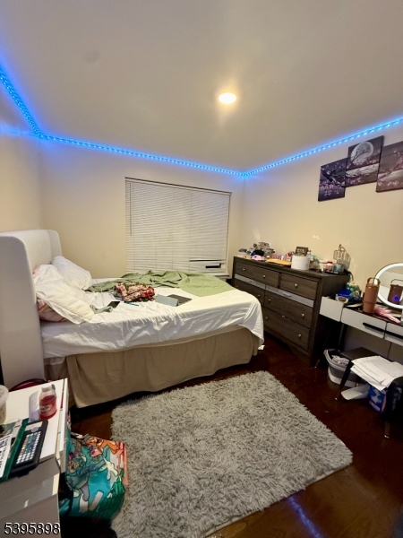 575 Hawthorne Avenue Newark, NJ 07112 - Photo 12 of 14 a bedroom with a bed and a table