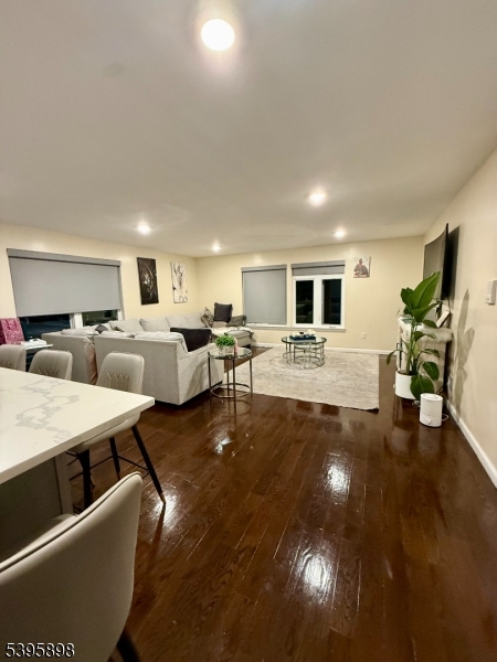 575 Hawthorne Avenue Newark, NJ 07112 - Photo 3 of 14 a living room with lots of furniture and view of kitchen