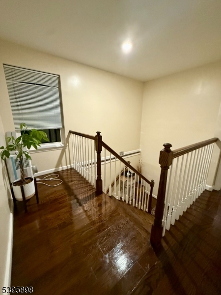 575 Hawthorne Avenue Newark, NJ 07112 - Photo 7 of 14 a view of entryway dining room and hall with wooden floor