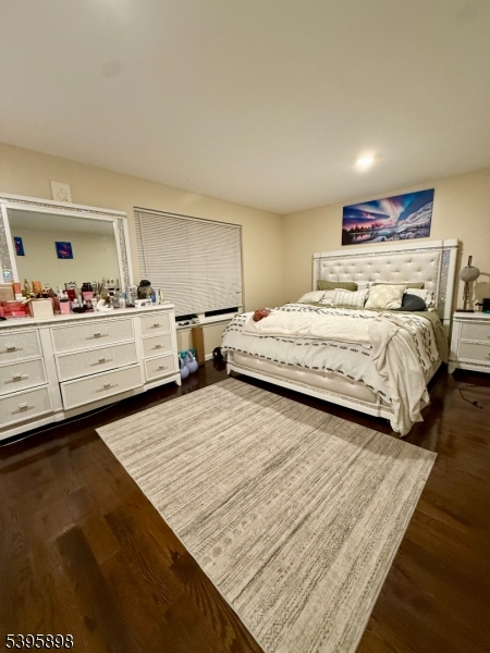 575 Hawthorne Avenue Newark, NJ 07112 - Photo 9 of 14 a bedroom with a bed and a dresser