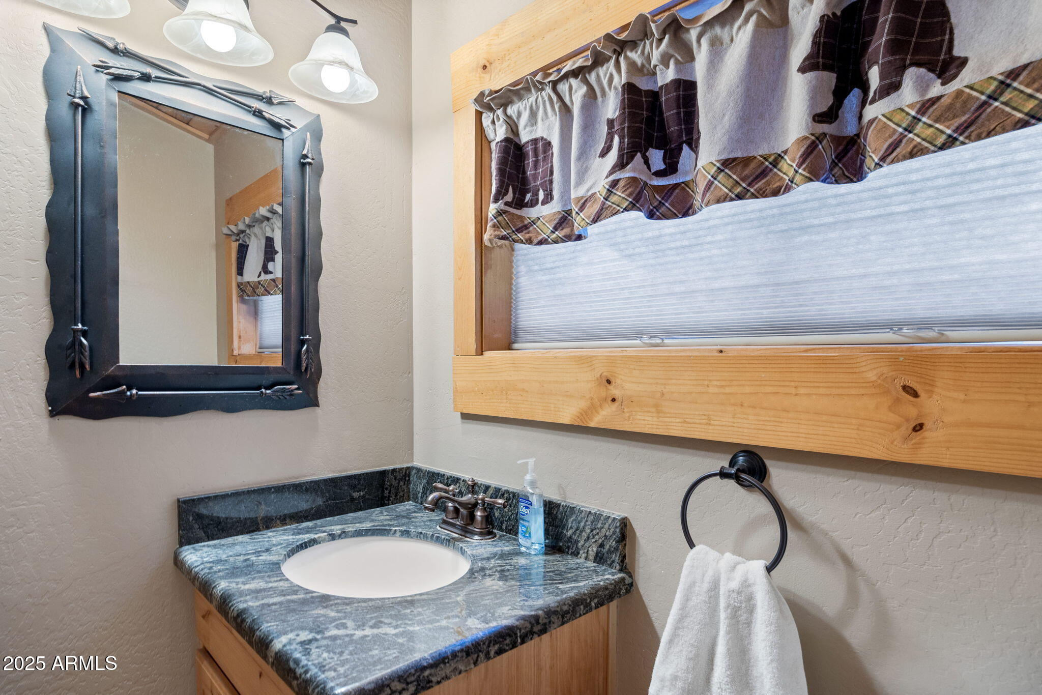 2300 Overgaard Springs Loop Overgaard, AZ 85933 - Photo 30 of 48 a bathroom with a granite countertop sink and a mirror