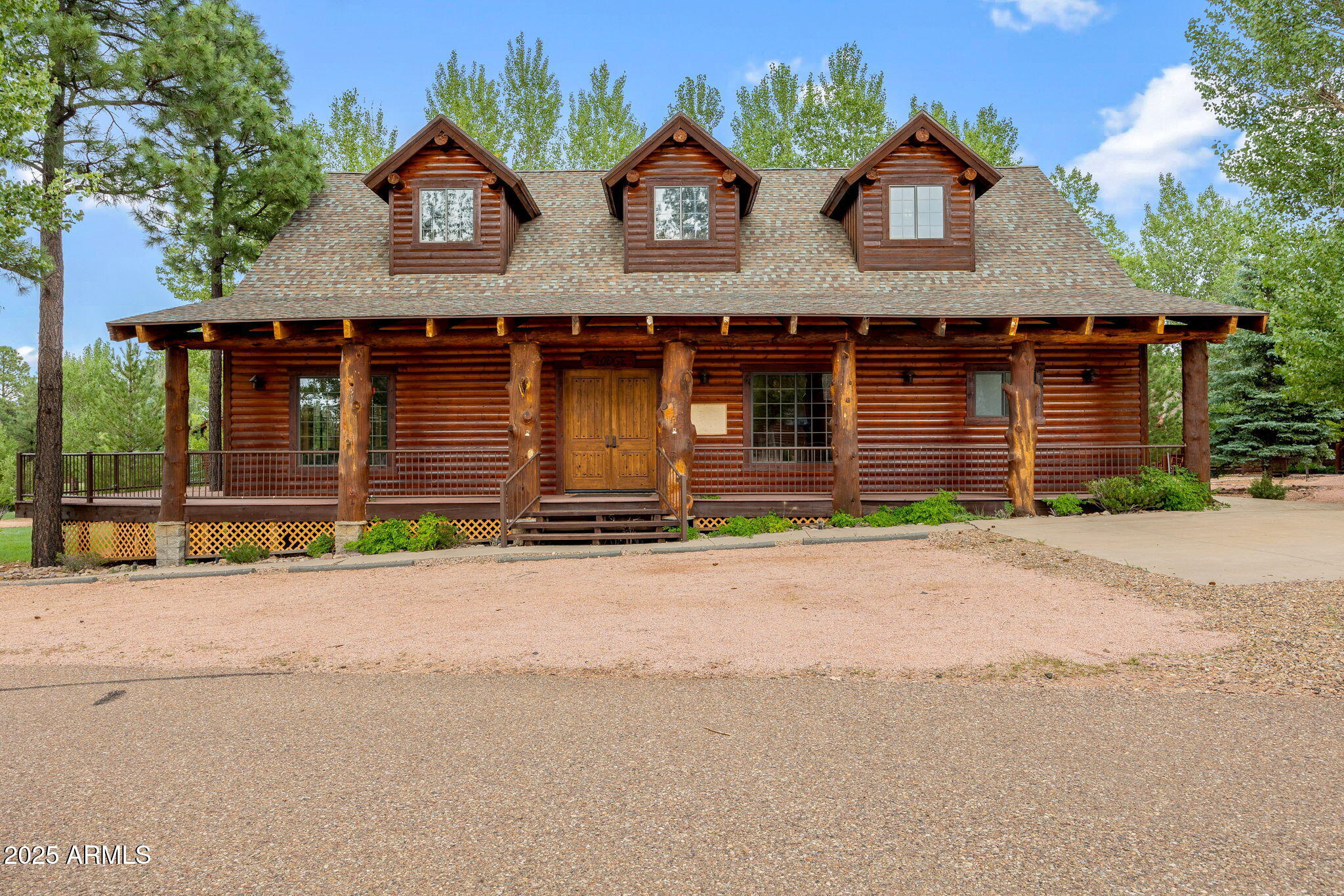 2300 Overgaard Springs Loop Overgaard, AZ 85933 - Photo 32 of 48 a front view of a house with garage