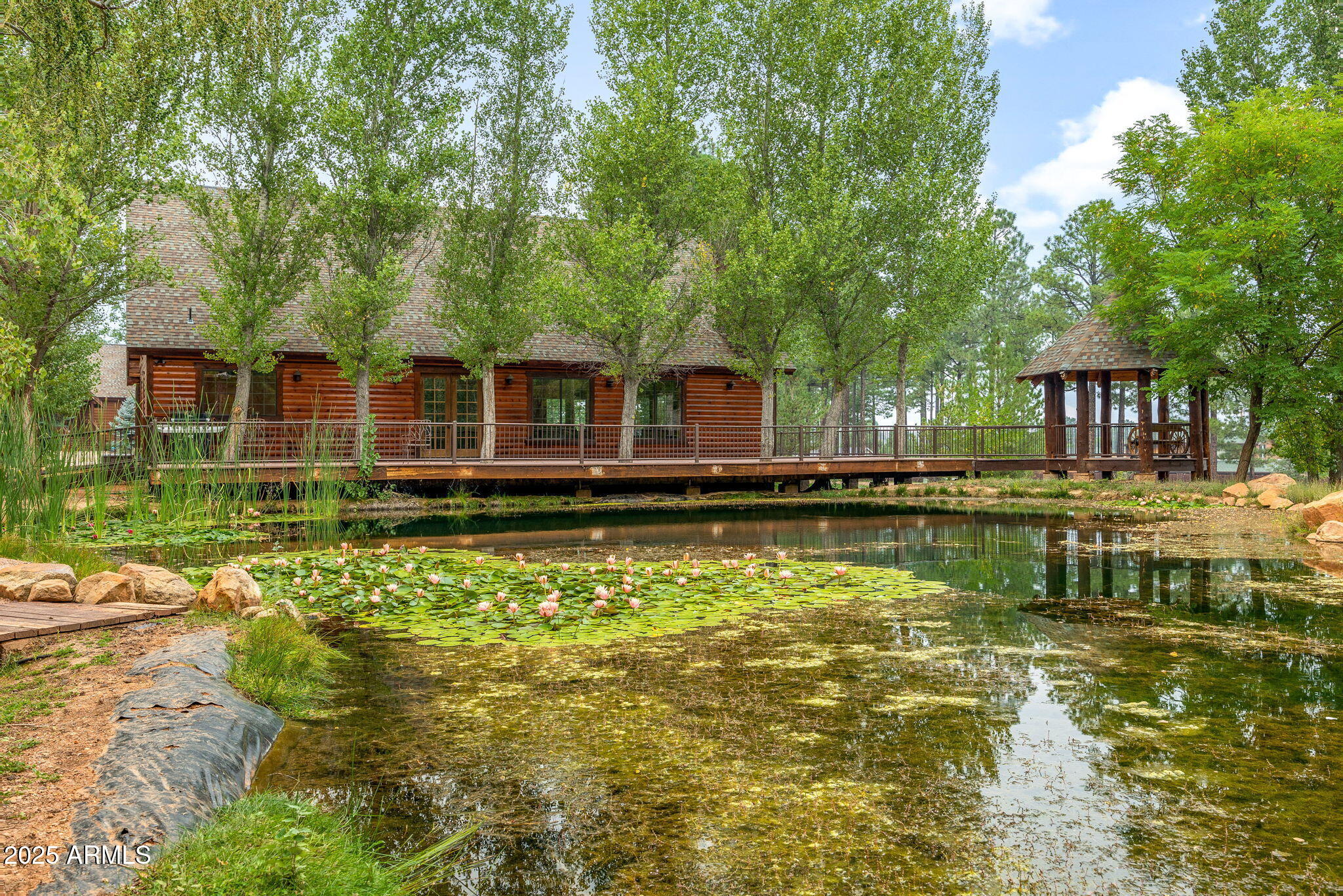 2300 Overgaard Springs Loop Overgaard, AZ 85933 - Photo 36 of 48 a front view of a house with swimming pool