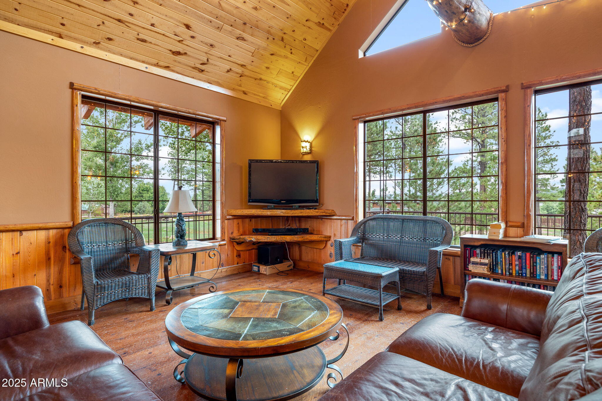 2300 Overgaard Springs Loop Overgaard, AZ 85933 - Photo 41 of 48 a living room with furniture a flat screen tv and a large window