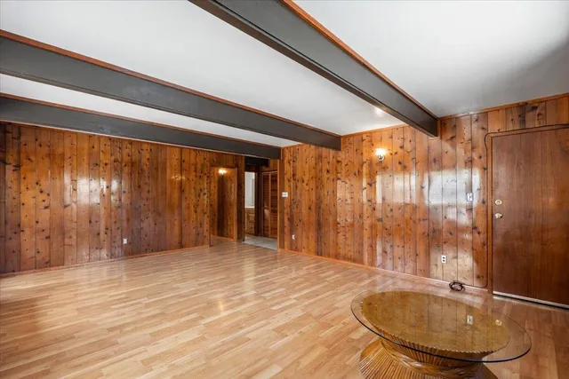a bathroom with a tub and shower