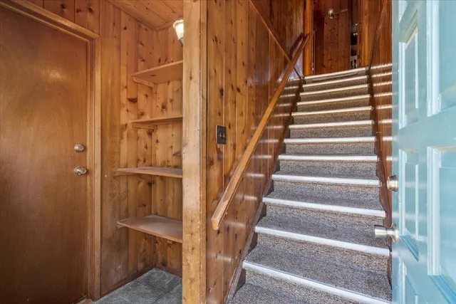 a view of entryway with wooden floor and stairs