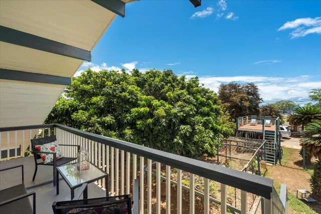 a view of a balcony with wooden floor