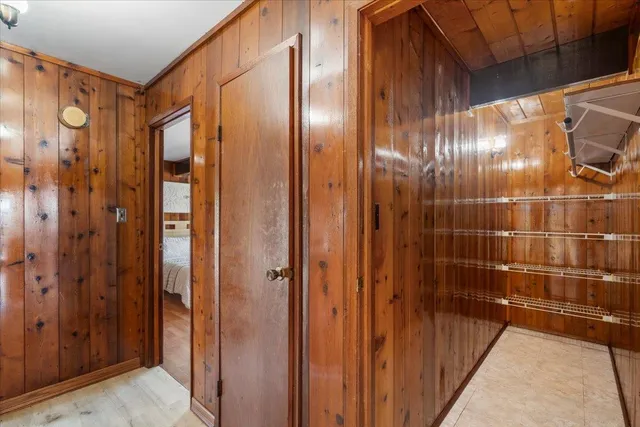 a bathroom with a shower and a glass door