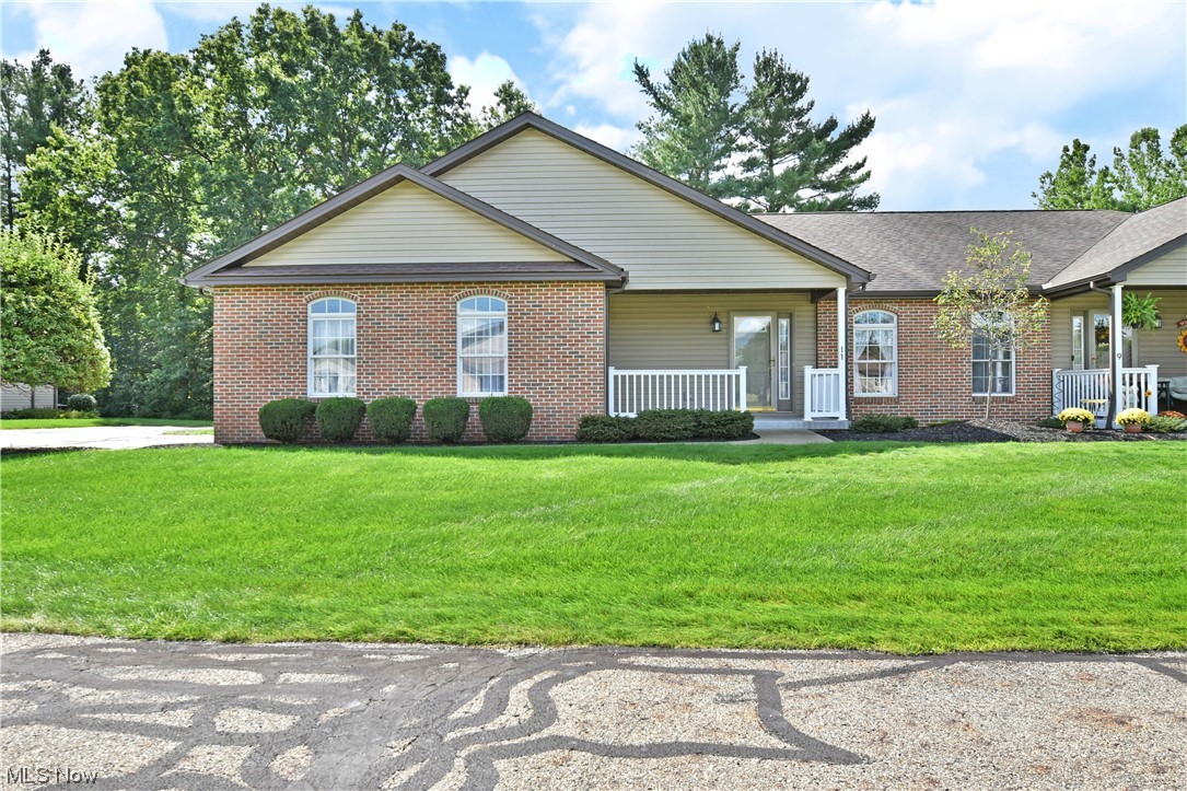2033 East River Road, Unit 11 Newton Falls, OH 44444 - Photo 33 of 35 Single story home featuring a porch and a front lawn