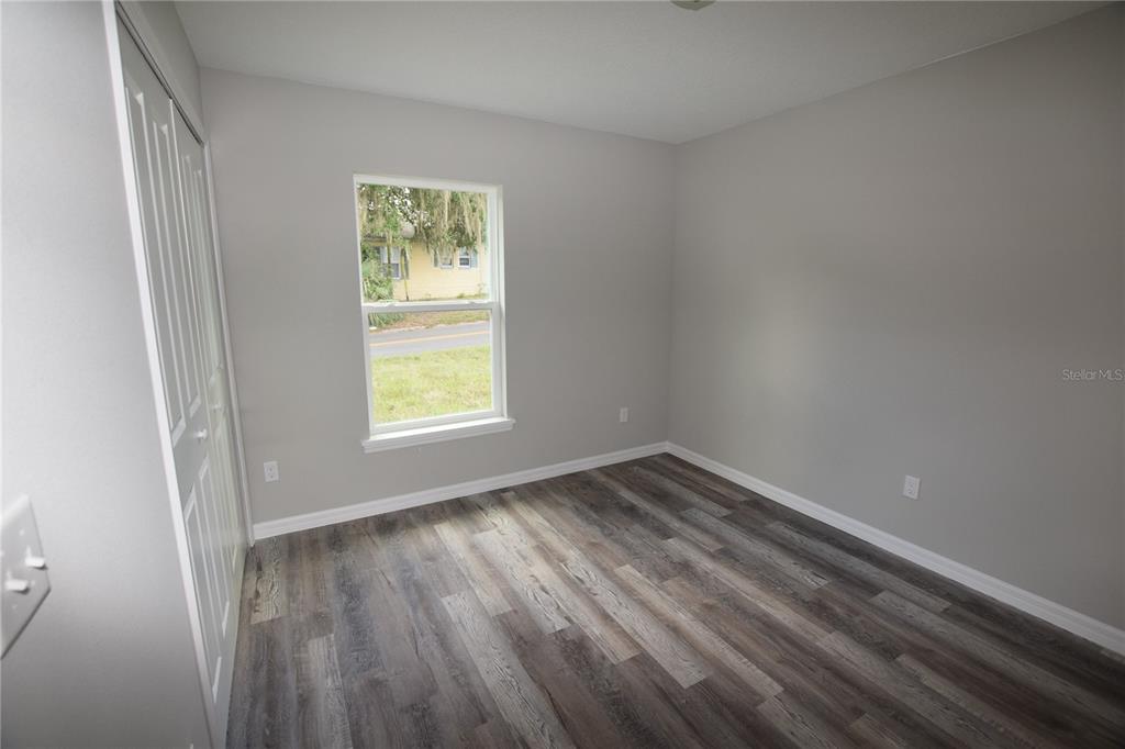220 Danvers Street Eustis, FL 32726 - Photo 13 of 15 a view of an empty room and window