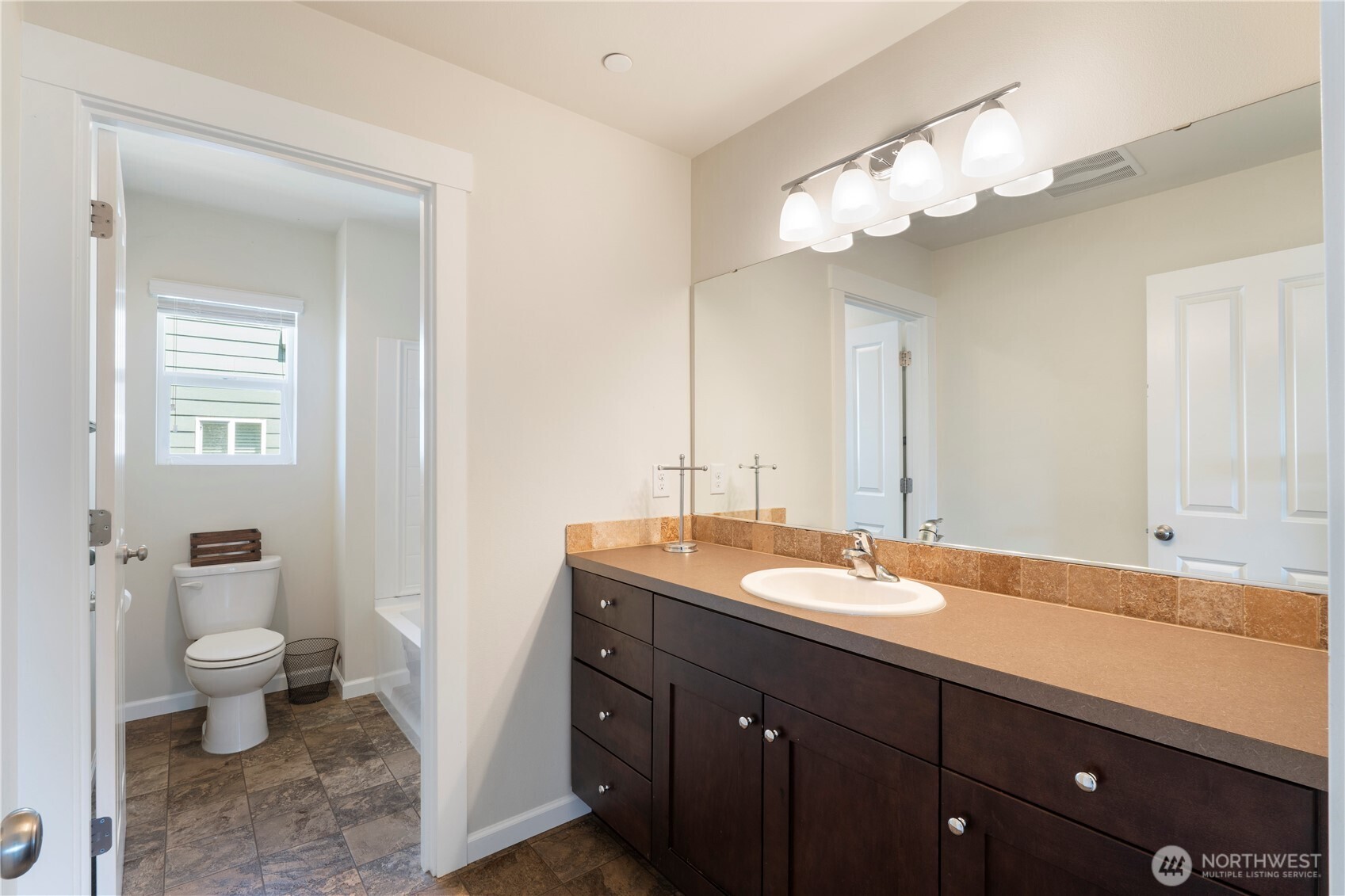5020 51st Ave Court West University Place, WA 98467 - Photo 16 of 24 a bathroom with a sink and a mirror