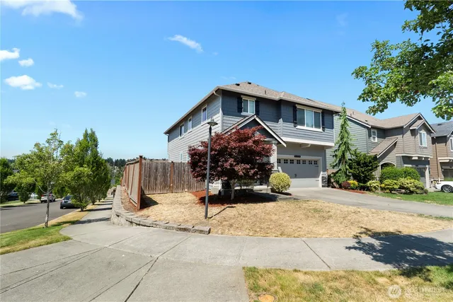 a front view of a house with a yard