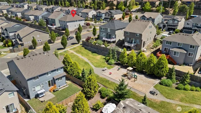 an aerial view of residential houses with outdoor space