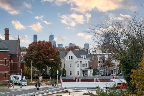 a bedroom with a bed and dresser