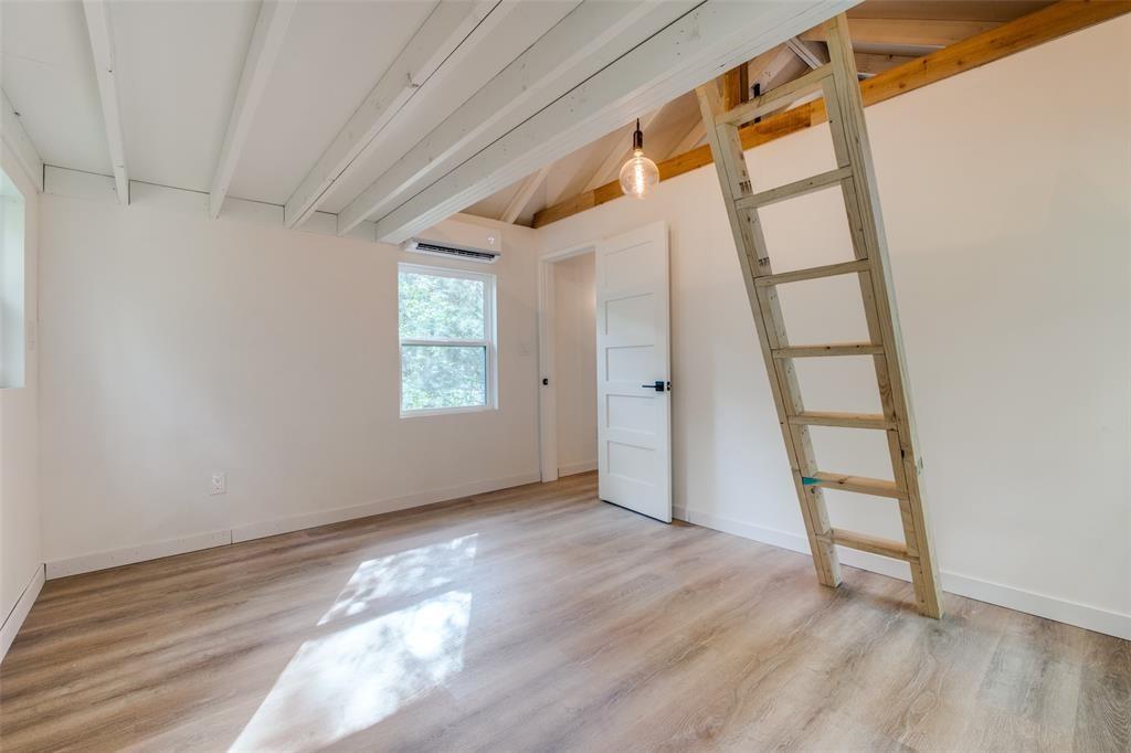 122 Allen Street Mabank, TX 75156 - Photo 7 of 10 an empty room with wooden floor and windows