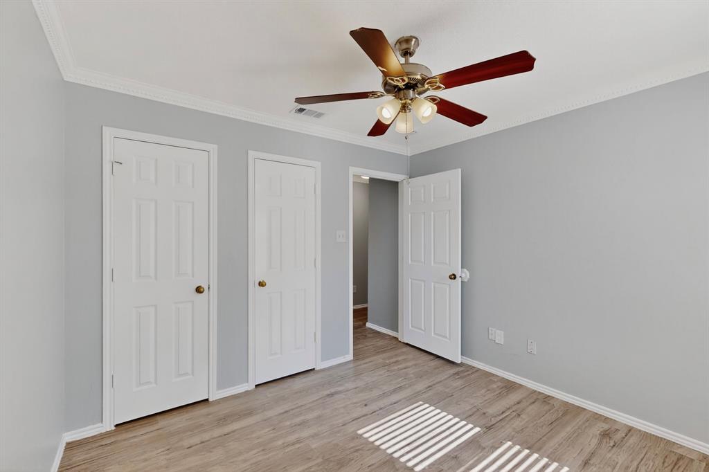 664 Phillips Drive Coppell, TX 75019 - Photo 13 of 24 a view of an empty room with wooden floor