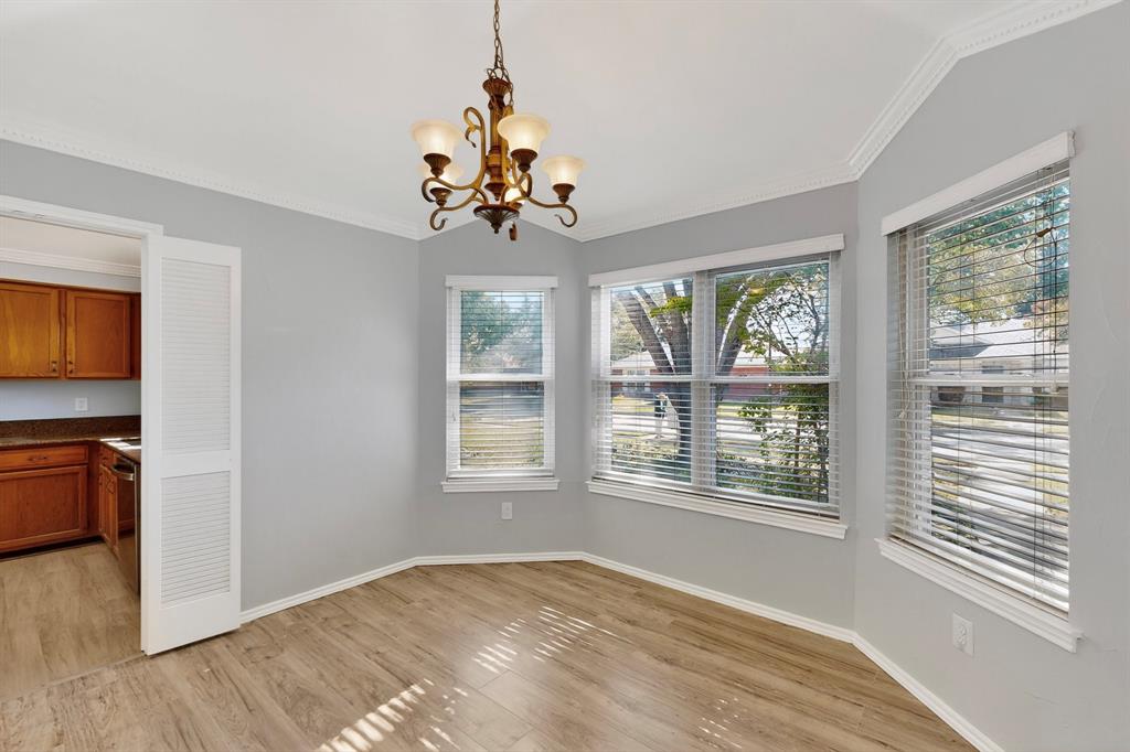 664 Phillips Drive Coppell, TX 75019 - Photo 15 of 24 a view of a room with a window and chandelier