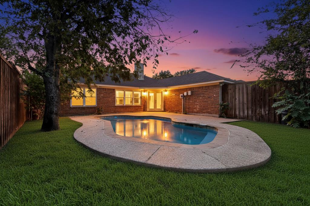 664 Phillips Drive Coppell, TX 75019 - Photo 3 of 24 a view of backyard with swimming pool and outdoor seating