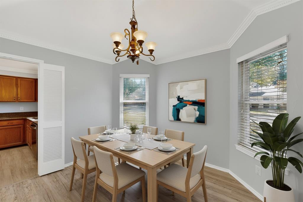 664 Phillips Drive Coppell, TX 75019 - Photo 5 of 24 a view of a dining room with furniture window and wooden floor