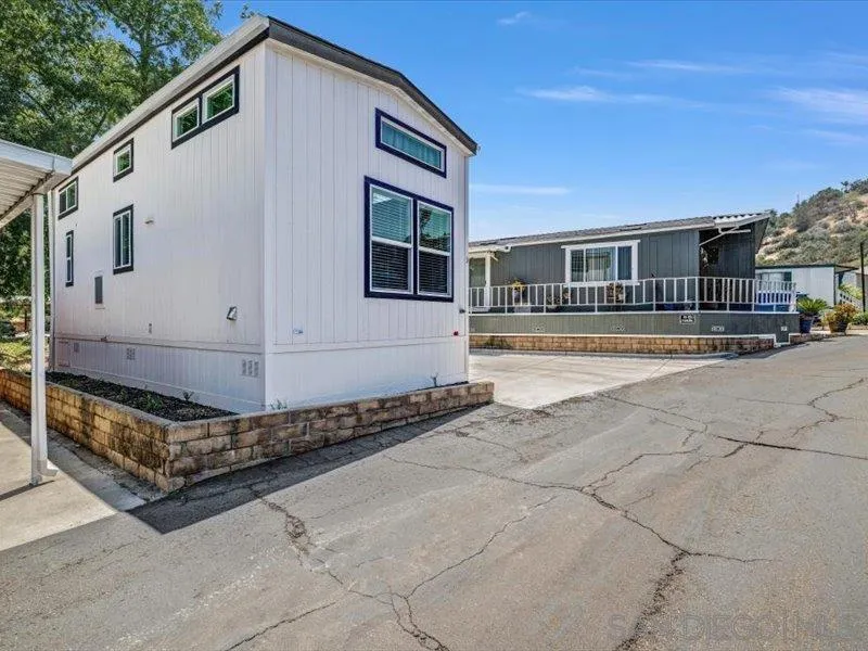 14291 Rios Canyon Road, Unit 3 El Cajon, CA 92021 - Photo 6 of 16 a front view of a house with a yard