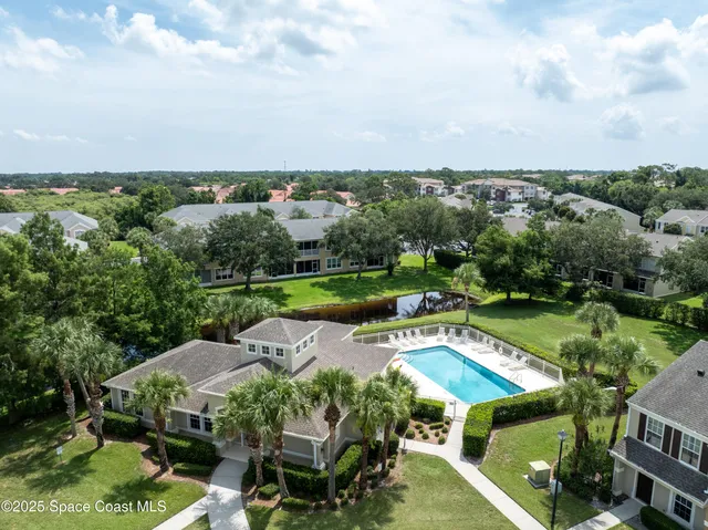 an aerial view of a house with a garden