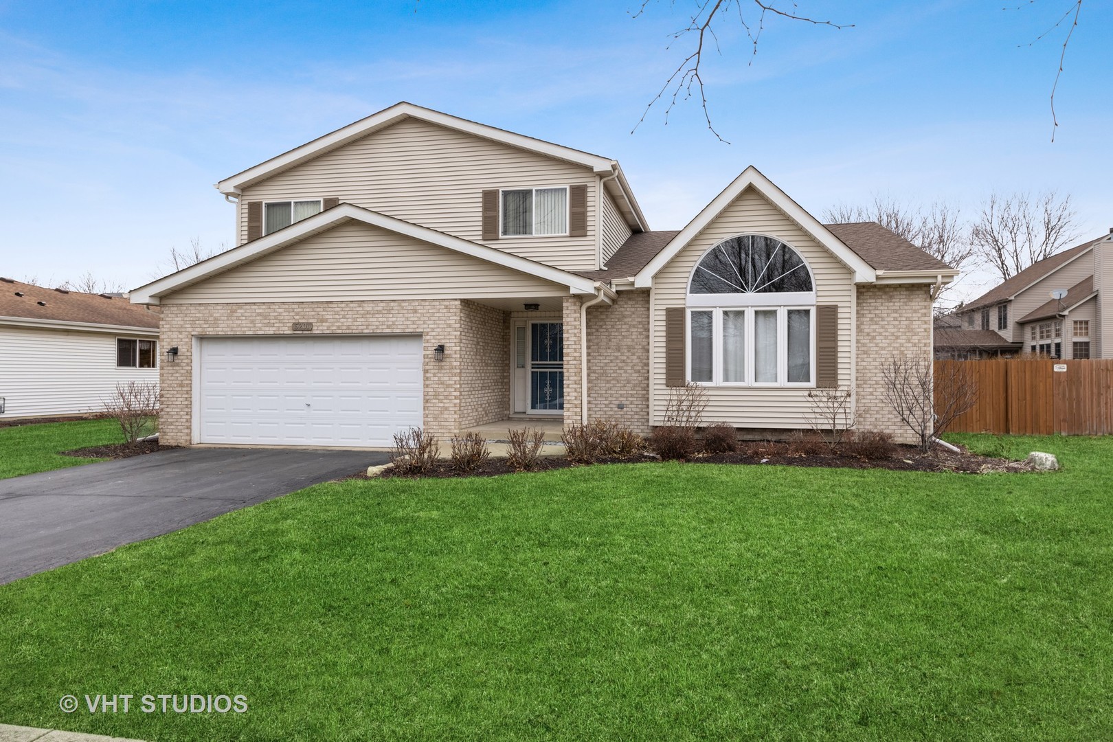 5201 Brighton Lane Plainfield, IL 60586 - Photo 1 of 18 a front view of a house with a yard and garage