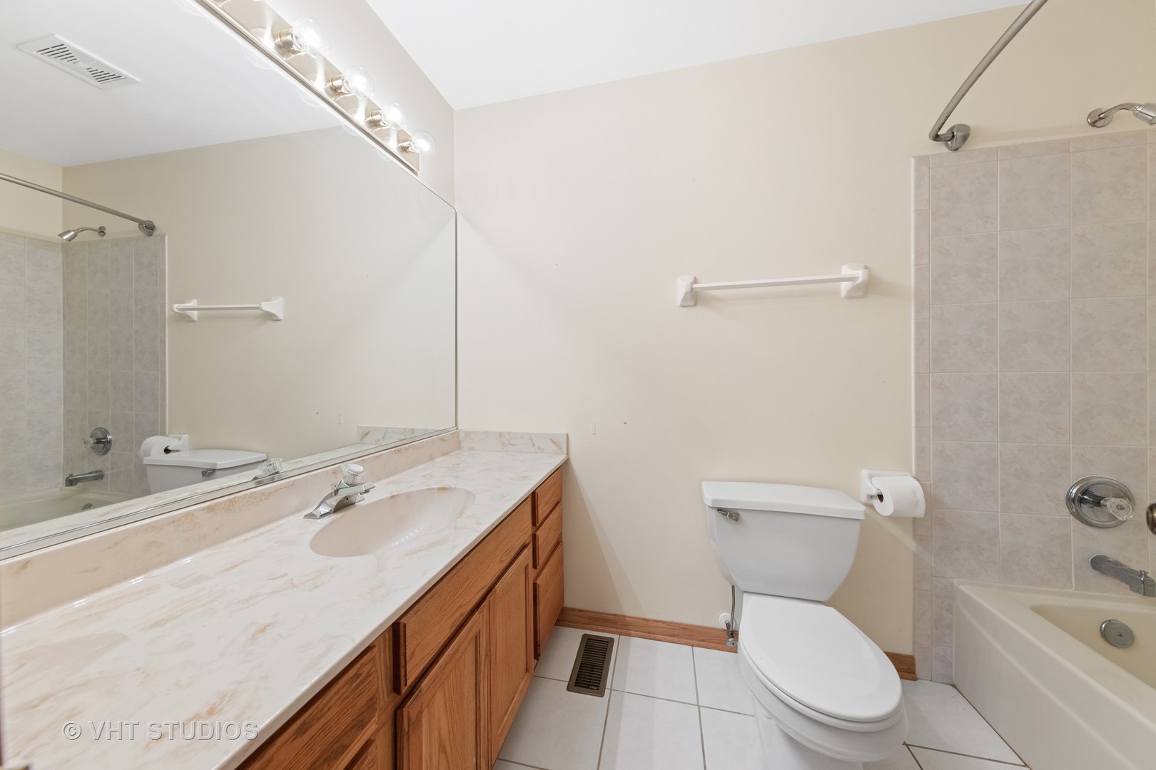 5201 Brighton Lane Plainfield, IL 60586 - Photo 12 of 18 a bathroom with a sink a toilet a mirror and shower