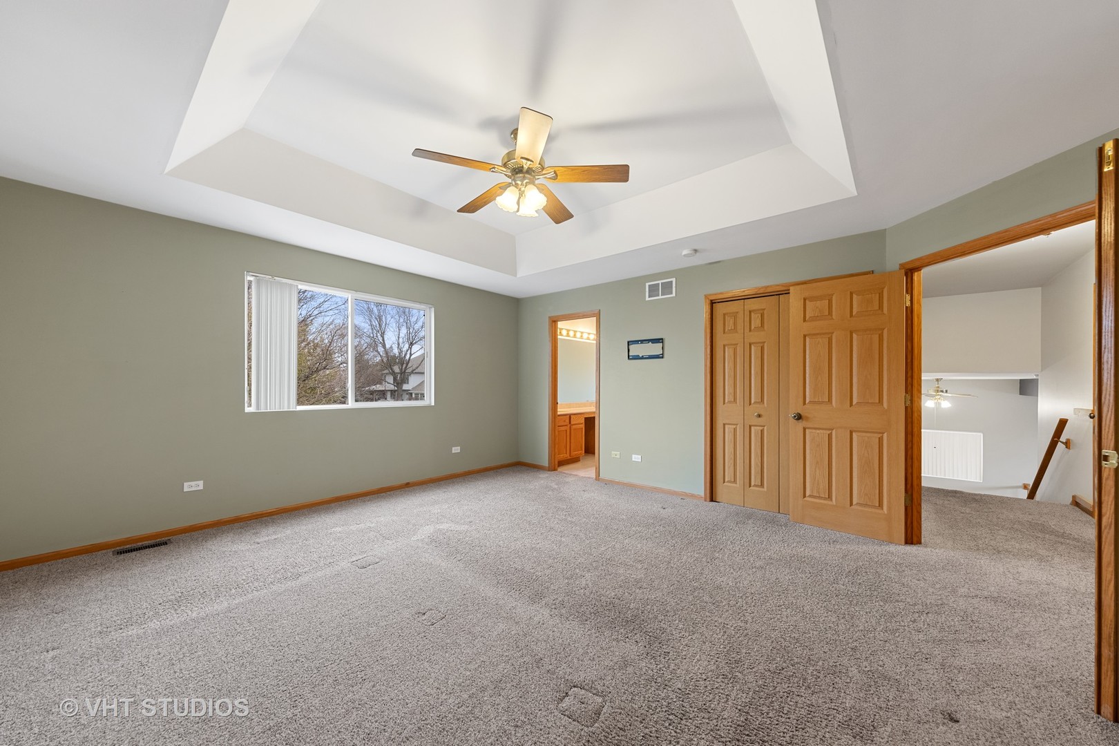 5201 Brighton Lane Plainfield, IL 60586 - Photo 13 of 18 a view of empty room with wooden floor and ceiling fan