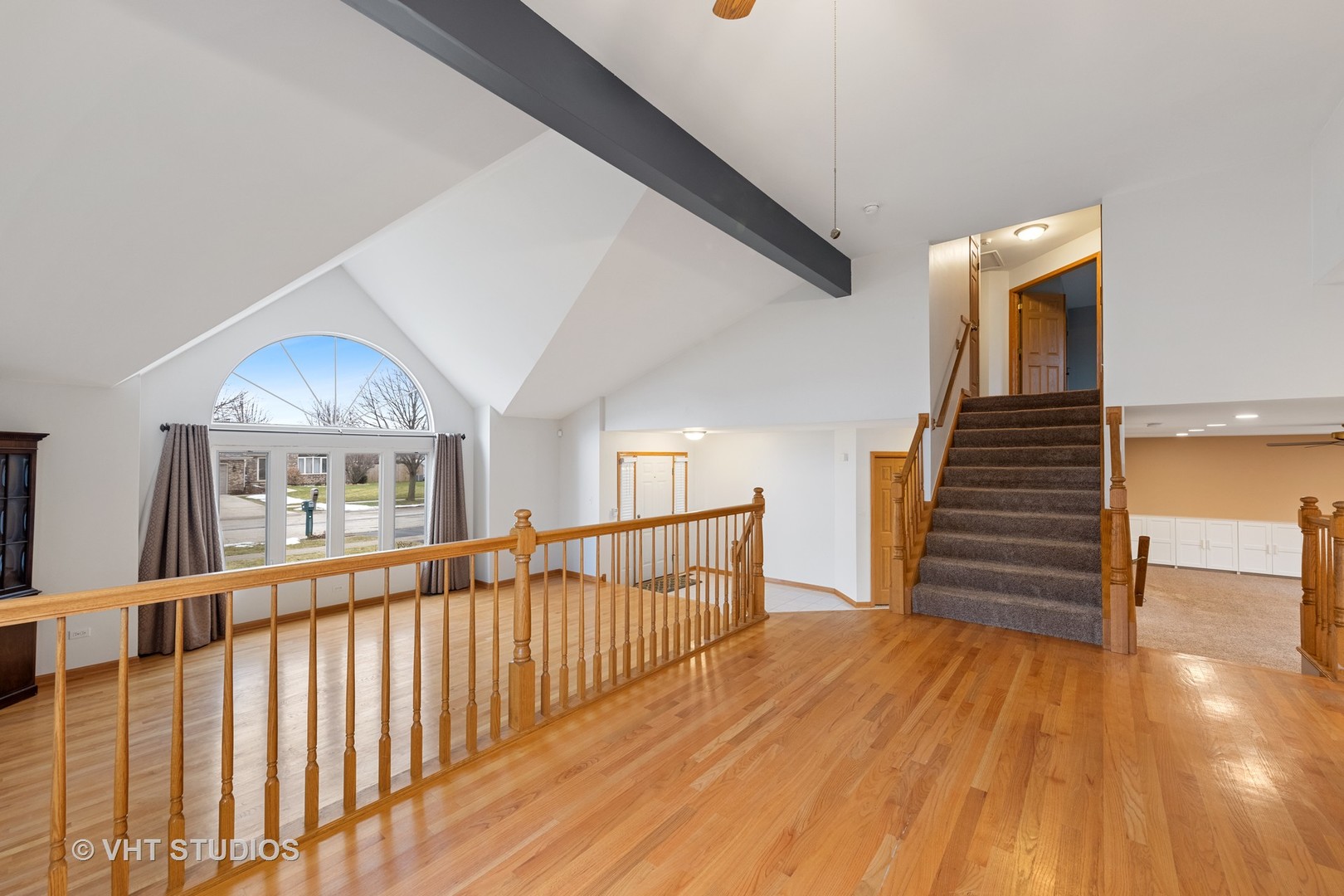 5201 Brighton Lane Plainfield, IL 60586 - Photo 4 of 18 a view of a hallway with wooden floor and staircase