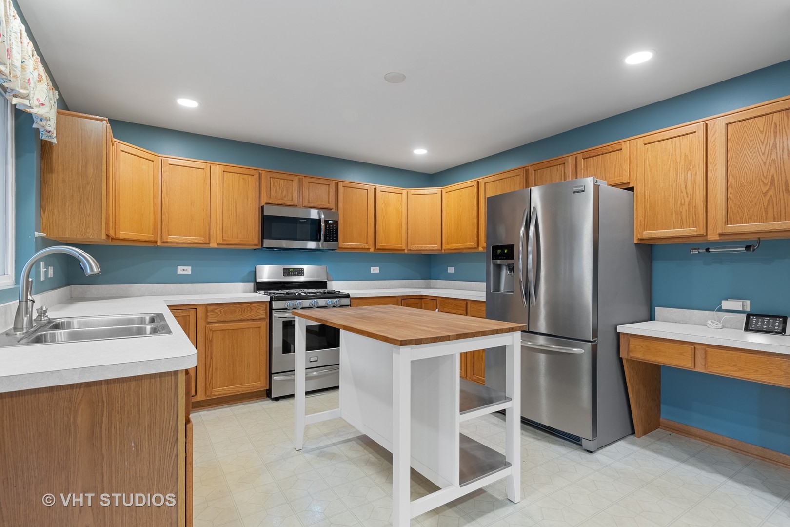 5201 Brighton Lane Plainfield, IL 60586 - Photo 5 of 18 a kitchen with stainless steel appliances granite countertop a refrigerator stove top oven a sink and dishwasher