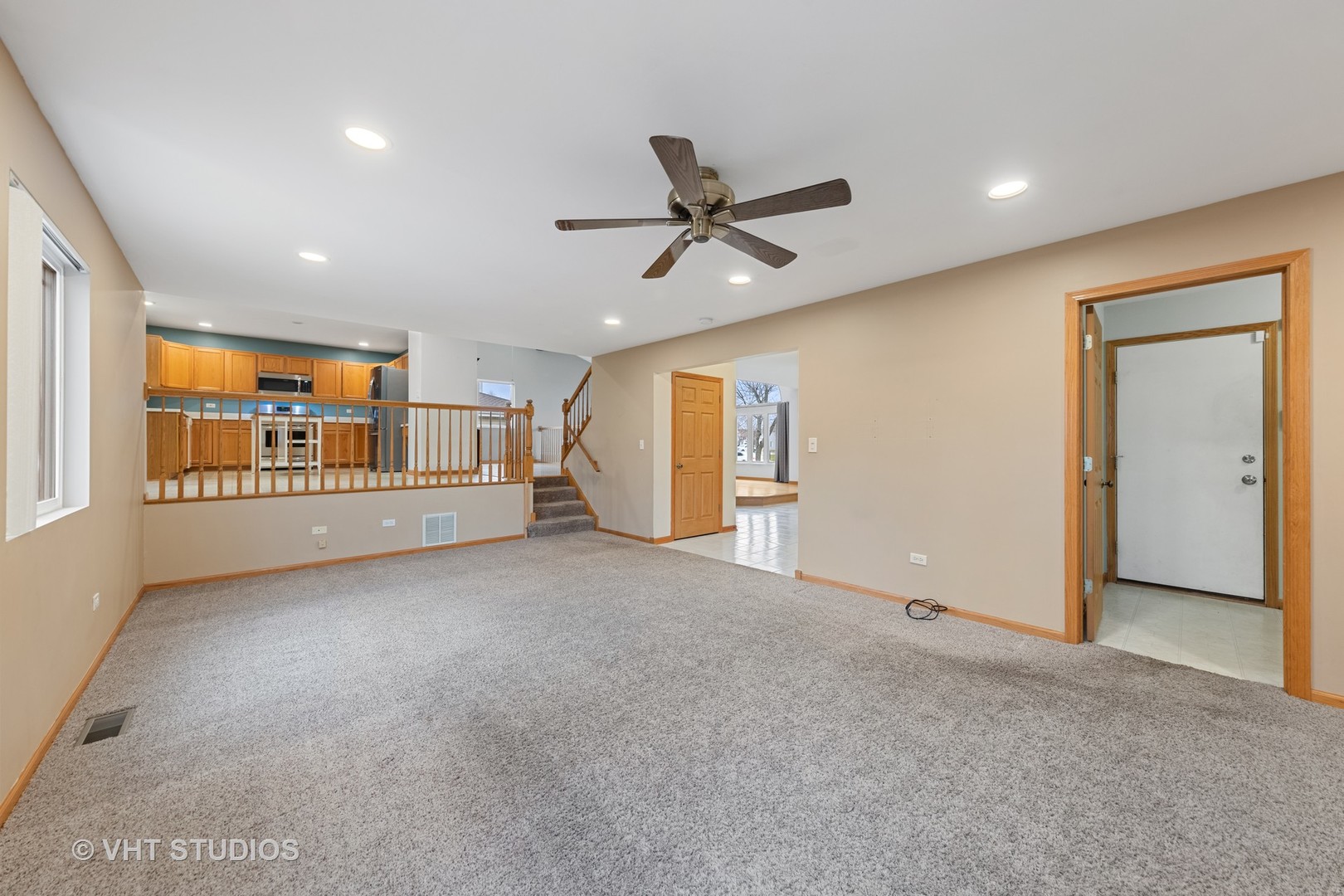 5201 Brighton Lane Plainfield, IL 60586 - Photo 9 of 18 a view of a livingroom with a ceiling fan and window
