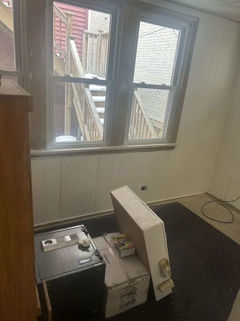 1123 West Vernon Park Place Chicago, IL 60607 - Photo 16 of 27 a bathroom with a window sink and cabinets