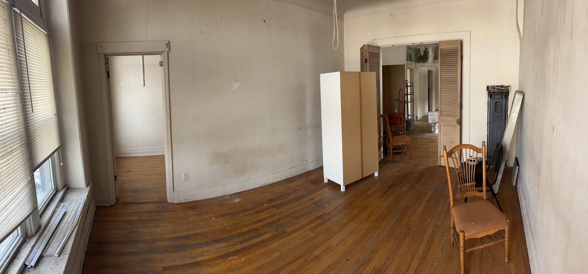 1123 West Vernon Park Place Chicago, IL 60607 - Photo 18 of 27 a view of a hallway with wooden floor and a living room