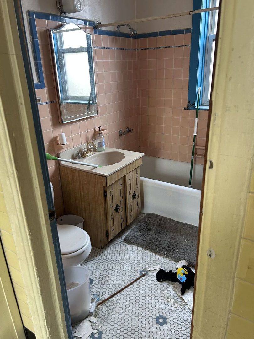 1123 West Vernon Park Place Chicago, IL 60607 - Photo 21 of 27 a bathroom with a sink toilet and shower