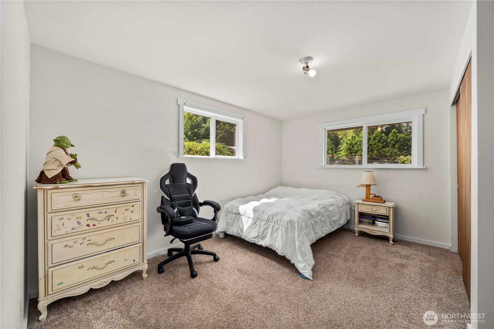 18201 Renton-Maple Valley Road Maple Valley, WA 98038 - Photo 17 of 37 a bedroom with a bed and a window