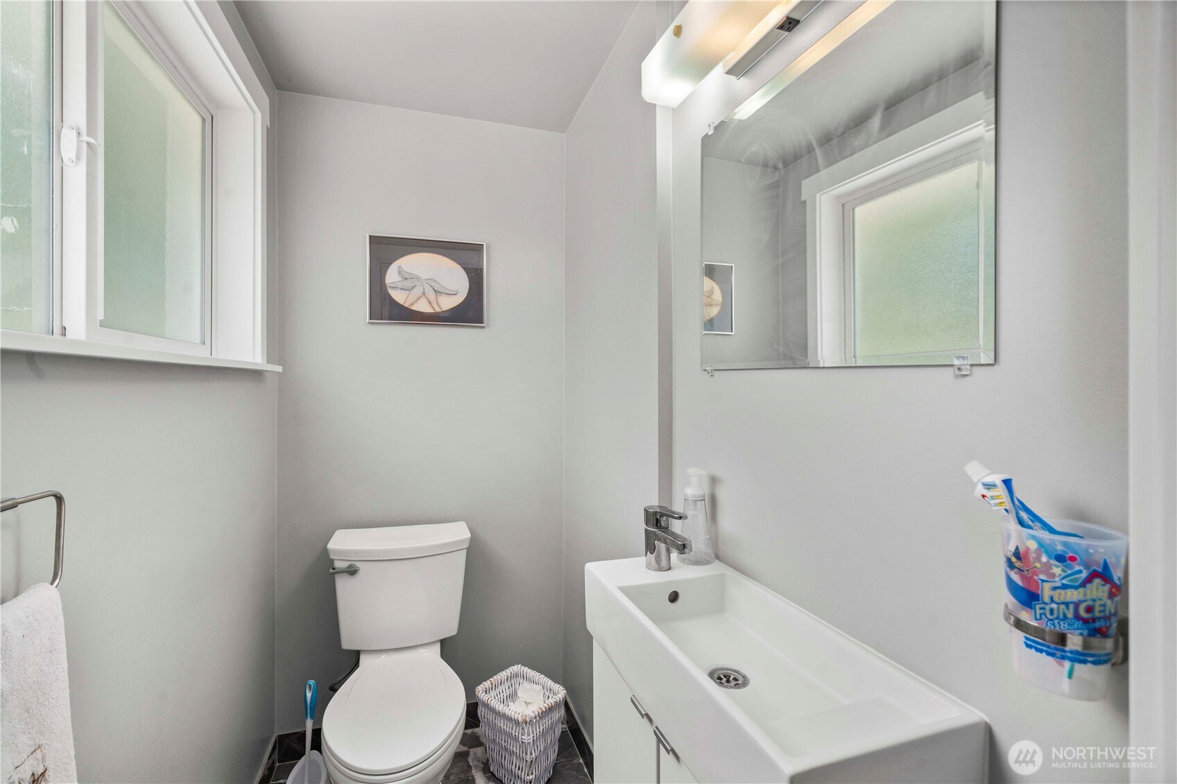 18201 Renton-Maple Valley Road Maple Valley, WA 98038 - Photo 18 of 37 a white toilet sitting next to a bathroom sink