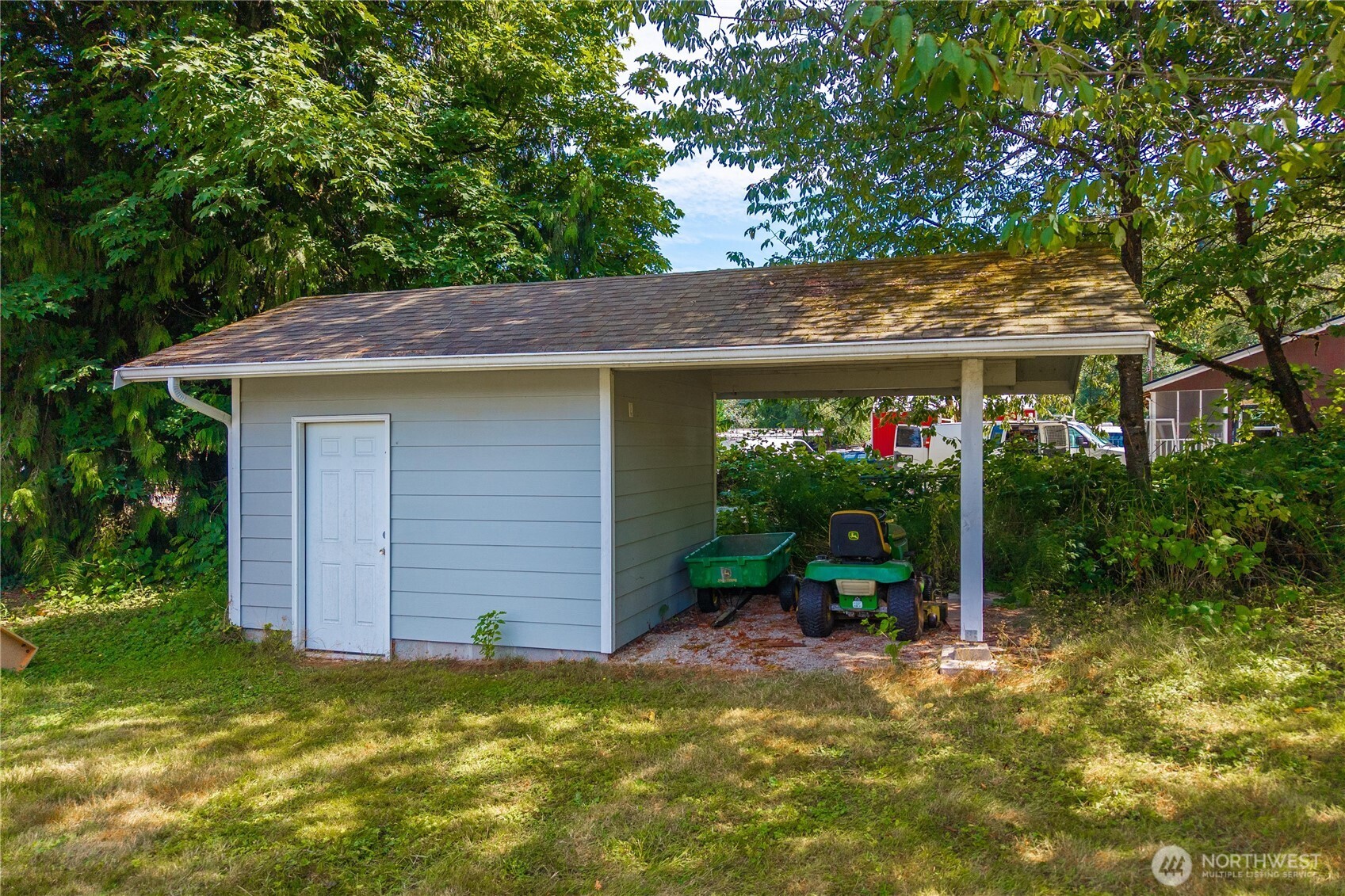 18201 Renton-Maple Valley Road Maple Valley, WA 98038 - Photo 25 of 37 a view of a house with a yard potted plants and a large tree