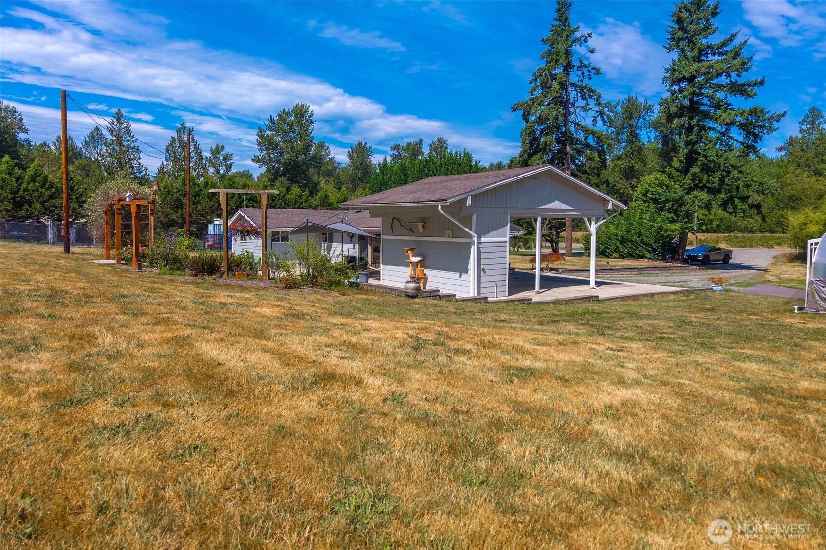 18201 Renton-Maple Valley Road Maple Valley, WA 98038 - Photo 26 of 37 a view of a house with a yard and sitting area