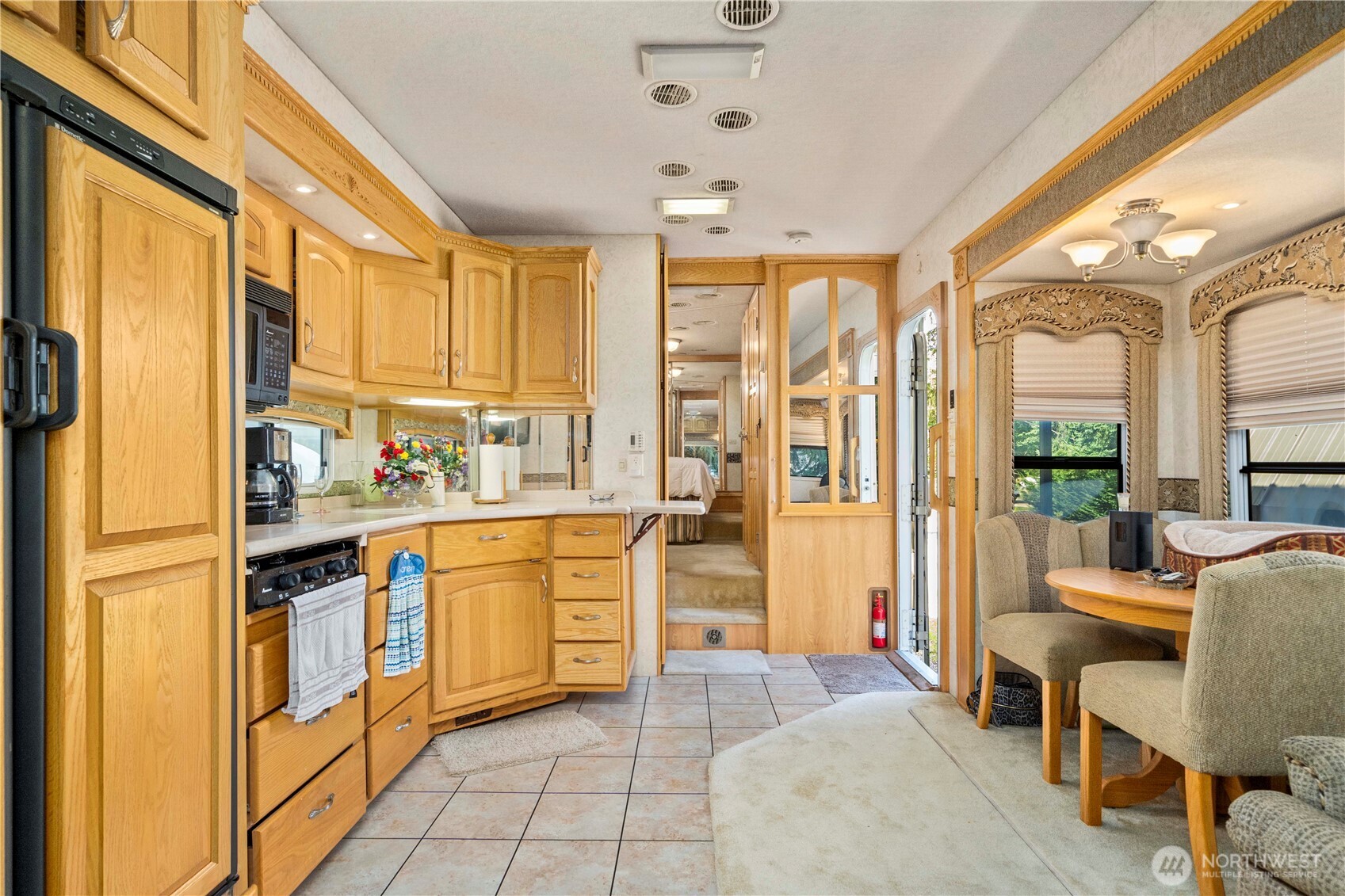 18201 Renton-Maple Valley Road Maple Valley, WA 98038 - Photo 36 of 37 a kitchen with stainless steel appliances granite countertop a refrigerator and a stove top oven
