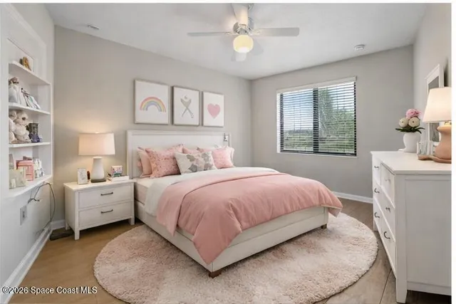 a spacious bedroom with a bed and a window